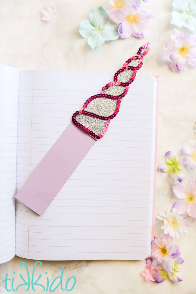 Unicorn horn bookmark made out of silver glitter craft foam and pink sequins.