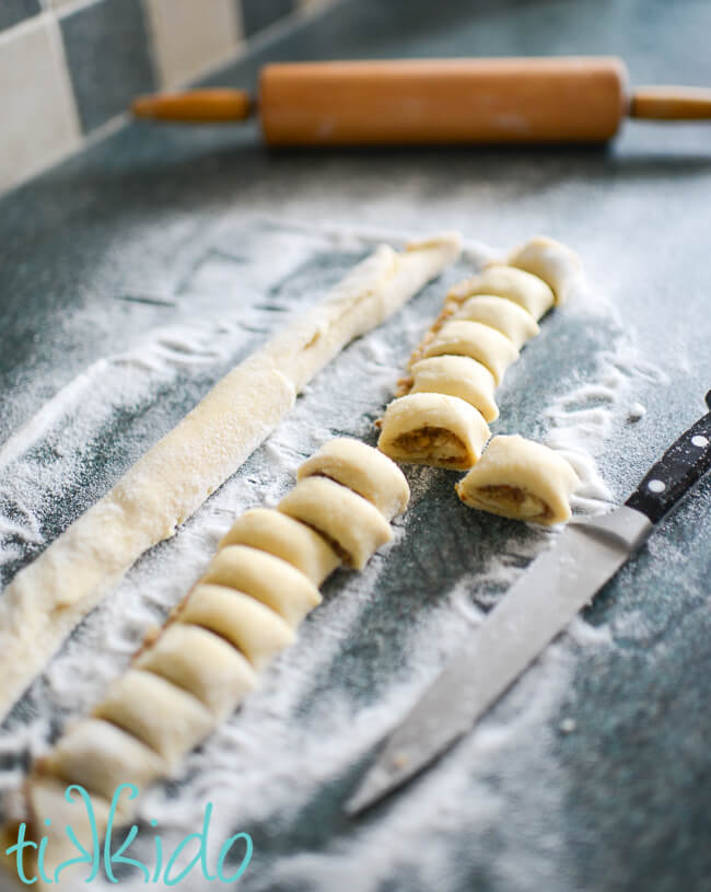 Easy rugelach being shaped into rugelach cookies.
