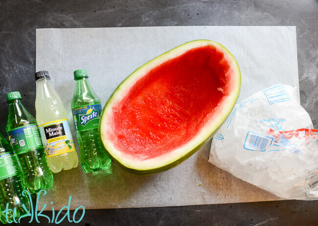 A hollowed out watermelon ready to be used as a drink cooler for a Watermelon Party.