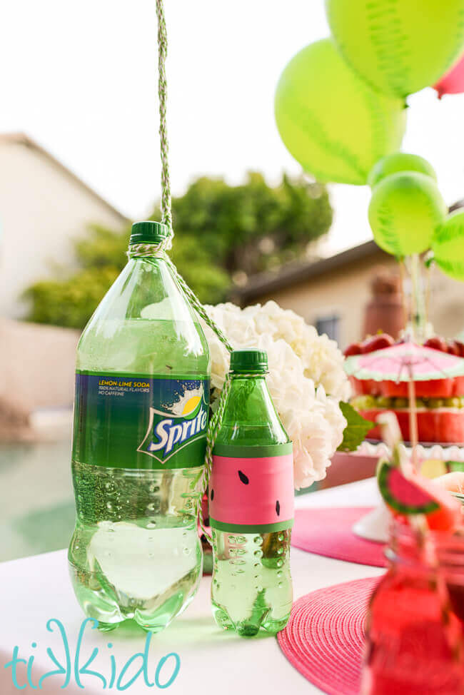 Soda bottle used as a balloon weight at the watermelon pool party.