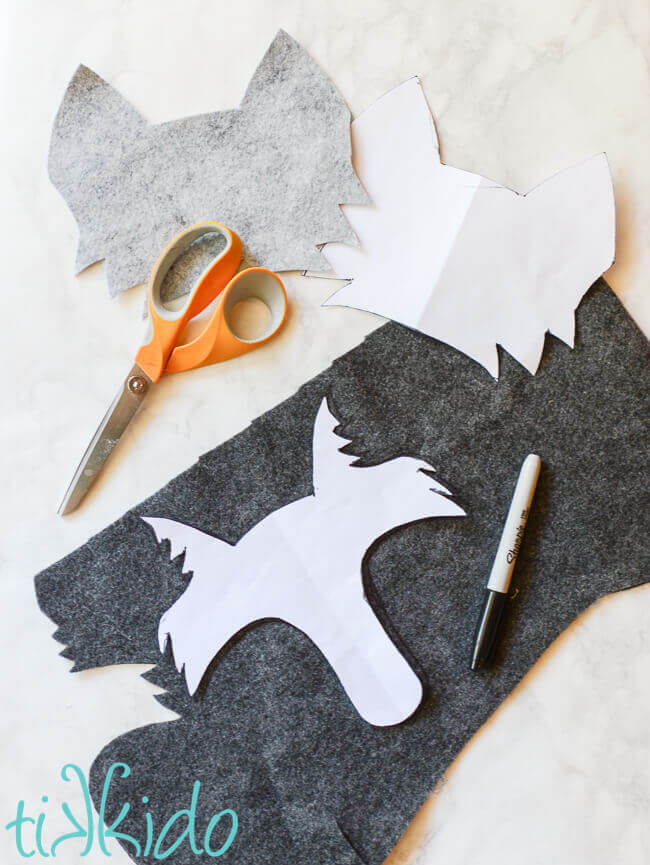 templates for cutting out the shape of a wolf head out of felt.