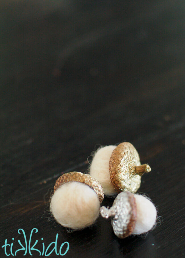 Three Felt Acorns with painted metallic acorn caps.