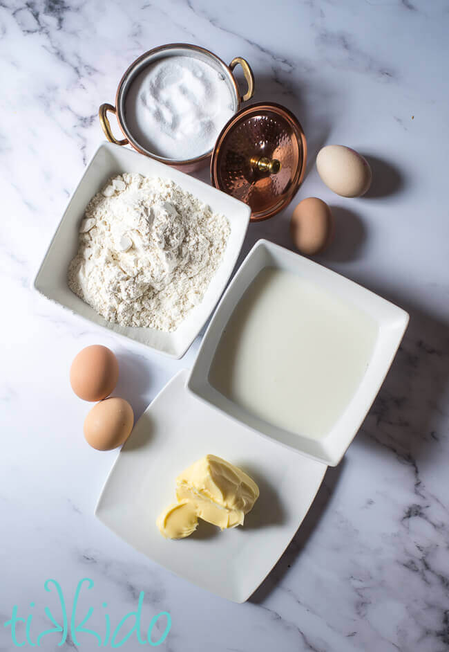 Yorkshire Pudding Ingredients on a white marble background.