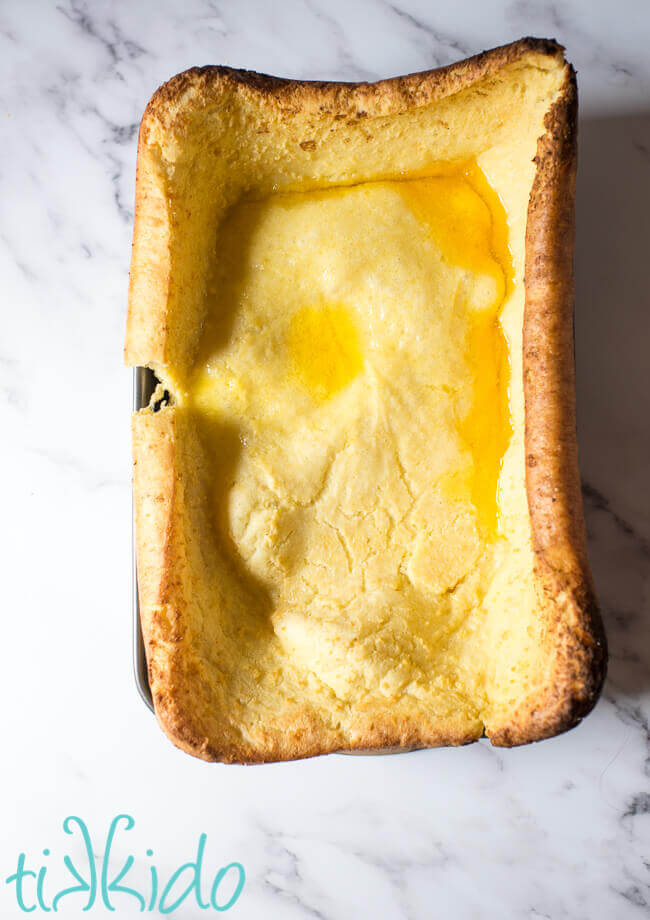 Freshly baked Yorkshire pudding, puffed up in a 9x13 pan.