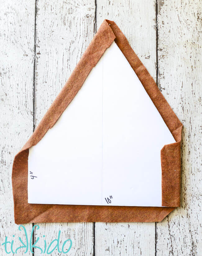 Front of the Felt Gingerbread House being covered with light brown felt.