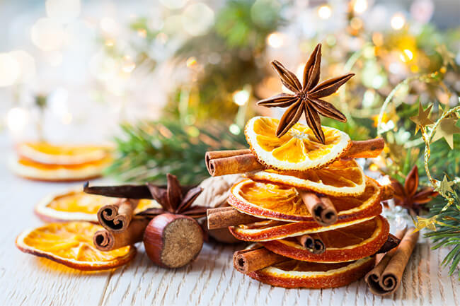 Dried oranges and whole spices for making simmer pot recipes.