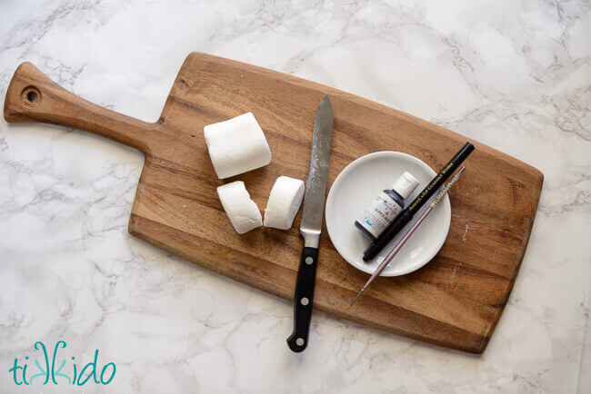 Materials for making Halloween full moon marshmallows for hot chocolate.