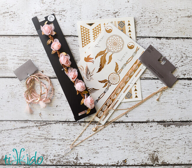 Bohemian themed birthday gifts on a white wooden background.