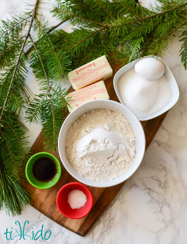 Ingredients for browned butter cookies on a wooden cutting board.