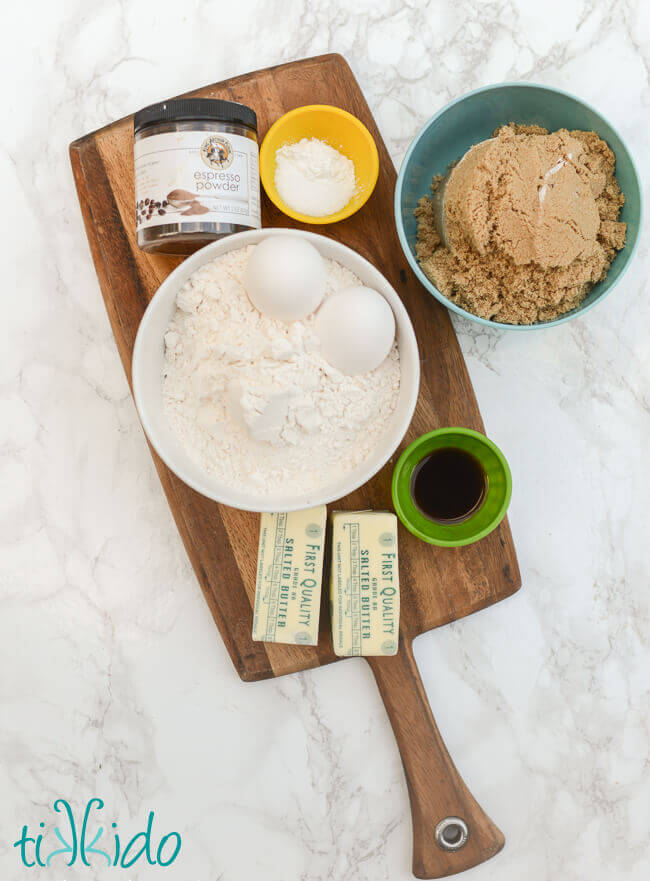 Ingredients for Cappuccino blondies coffee bar cookies on a wooden cutting board.