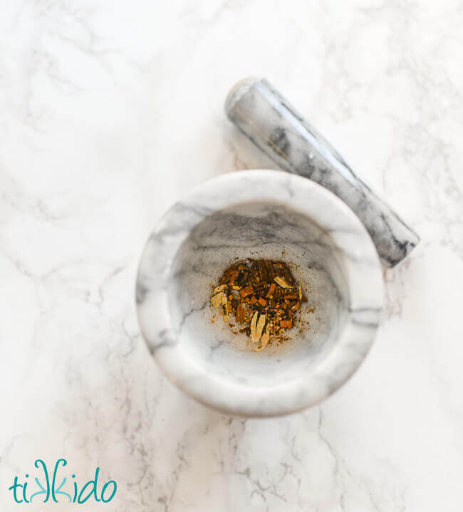 Homemade chai spices and a mortar and pestle