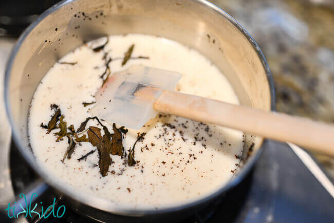 Homemade chai spices and tea leaves simmering in milk