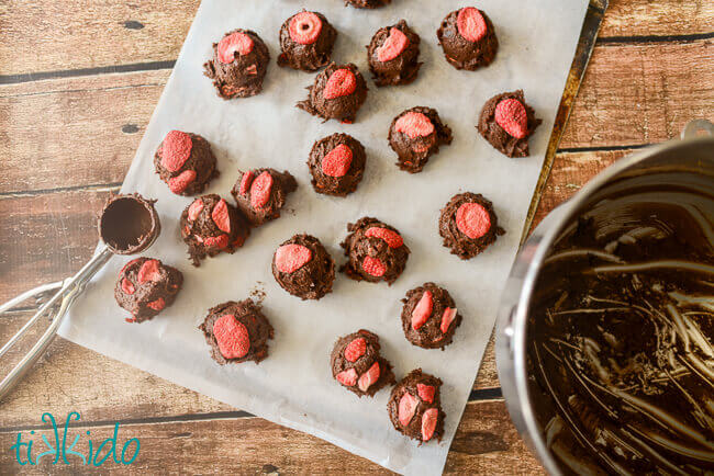 Chocolate Covered Strawberry Cookie dough being scooped out to freeze prior to baking.