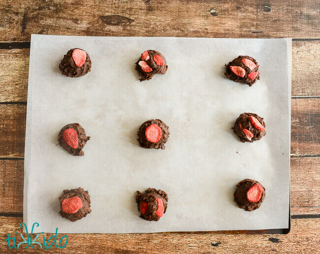 Chocolate Covered Strawberry Cookies ready to bake on a parchment-lined cookie sheet.