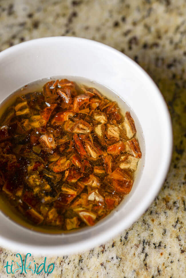 Dates for Date Nut Bread soaking in a bowl of water.