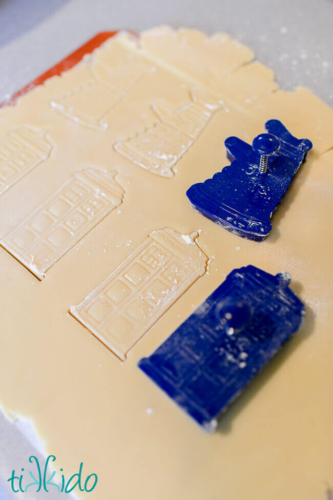 Doctor Who sugar cookies being cut out of sugar cookie dough.