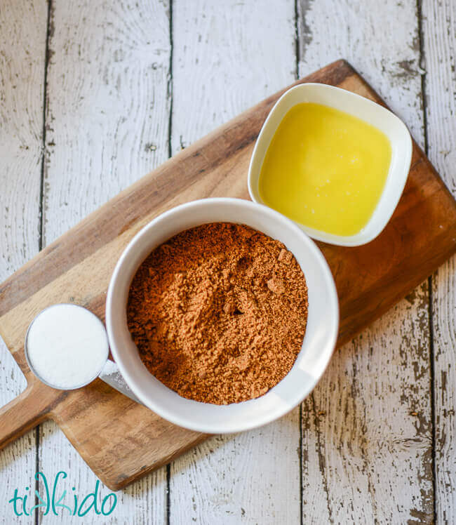 Ingredients for gingerbread crumb pie crust on a wooden cutting board.