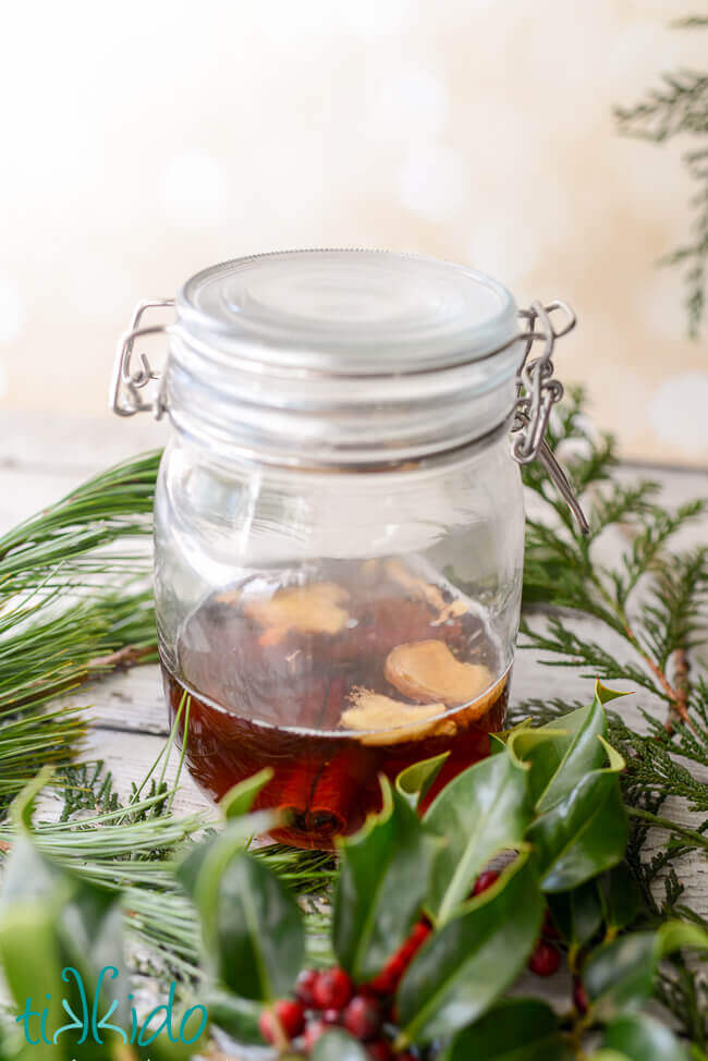 Ginger and cinnamon flavoring rum in a mason jar for gingerbread liqueur