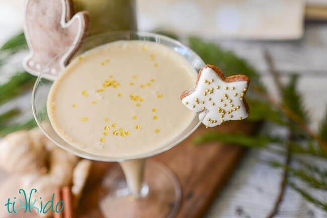 Gingerbread liqueur in a martini glass garnished with a gingerbread cookie