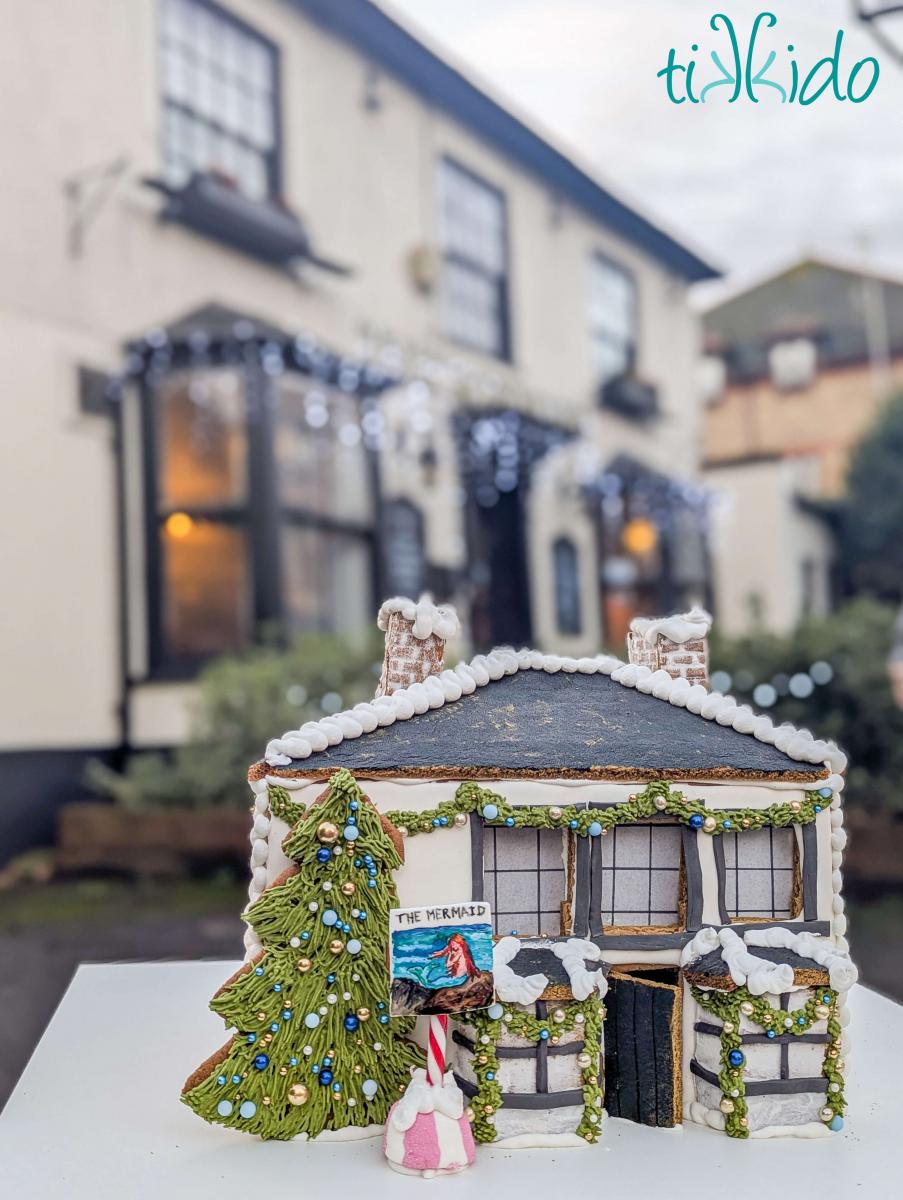 Gingerbread version of The Mermaid pub in St Albans, England, in front of the actual pub.