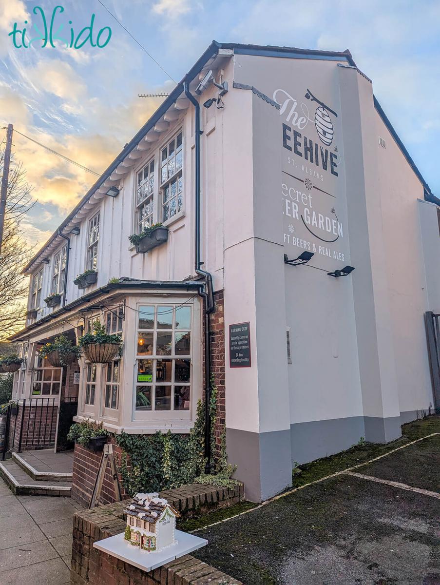 Gingerbread replica of The Beehive pub in St Albans in front of the actual pub.