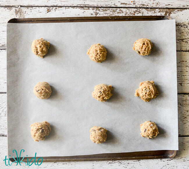 oatmeal chocolate chip cookie dough on a cookie sheet