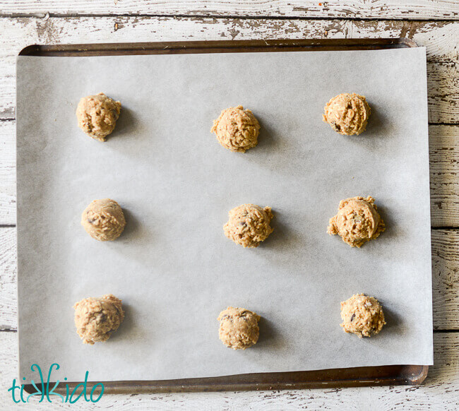 oatmeal chocolate chip cookie dough on a cookie sheet.