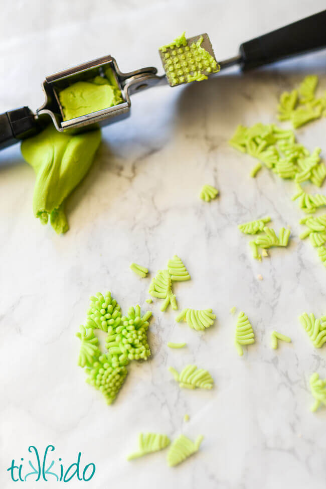 Homemade sprinkles extruded from a garlic press, separated into individual sprinkles.