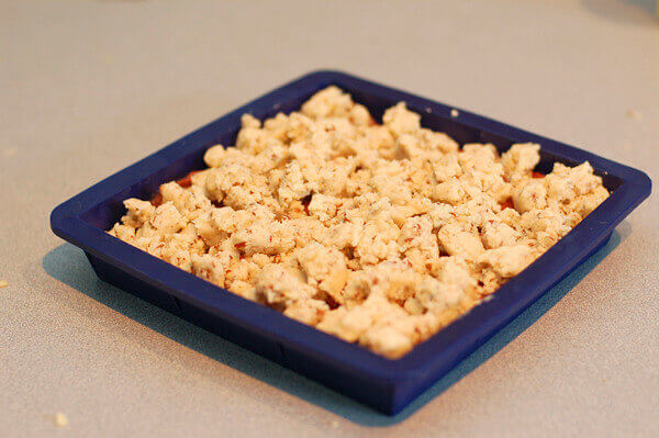 Rhubarb bar cookies, uncooked, in silicone pan.