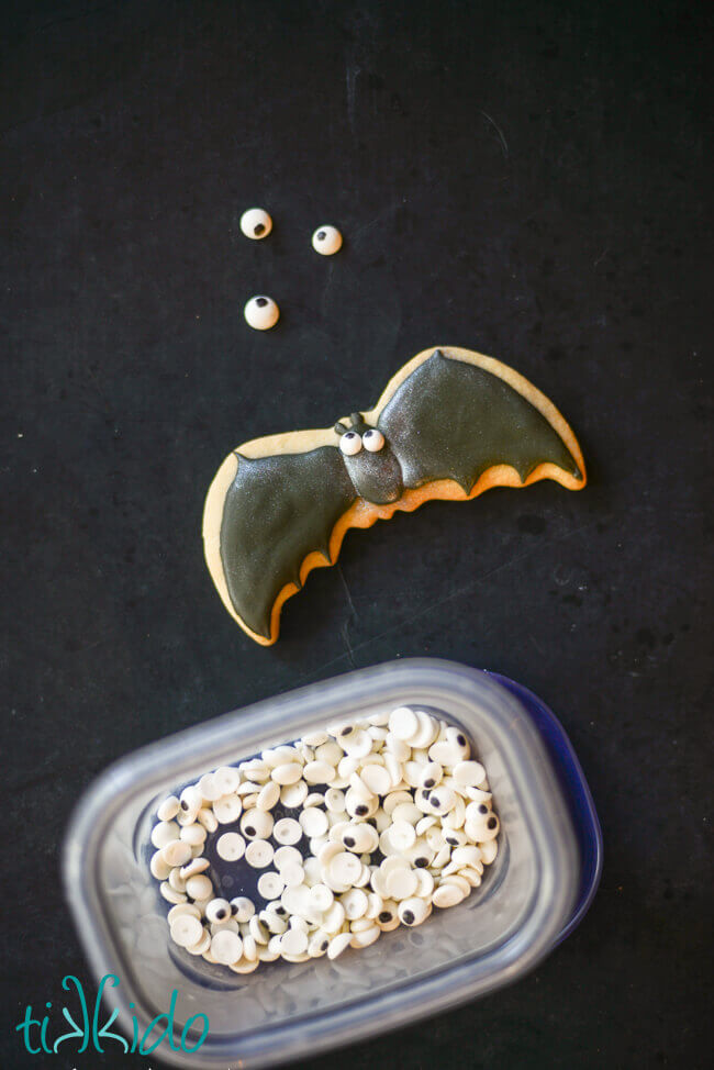Bat sugar cookie decorated with edible googly eyes.