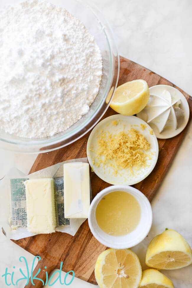 Lemon Icing ingredients on a wooden cutting board.