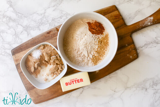 Crumb topping ingredients on a wooden cutting board.