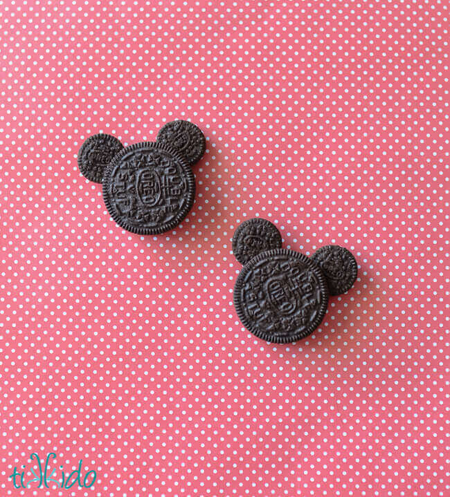 Easy Oreo Mickey Mouse cookies on a red and white polka dot background.