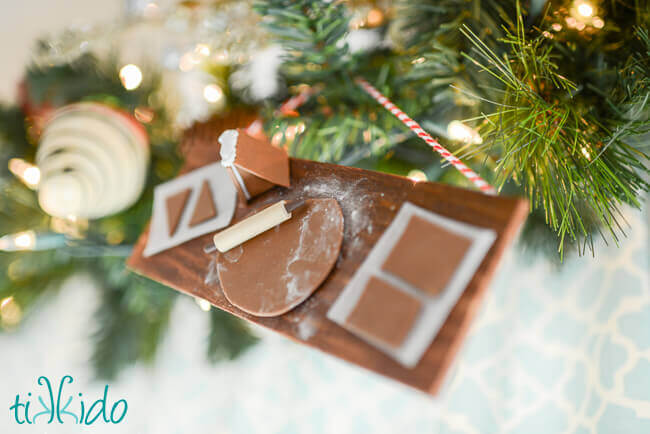 Gingerbread baking Christmas ornament hung on a Christmas tree