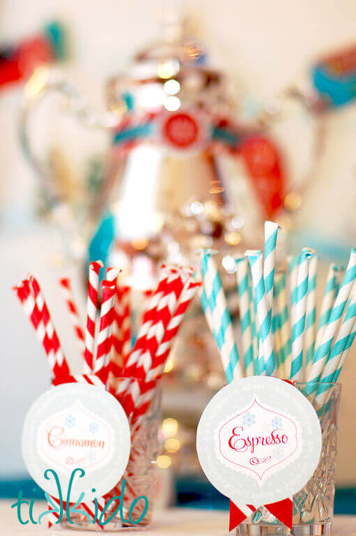 Homemade hot chocolate flavor add ins packaged in striped paper straws.