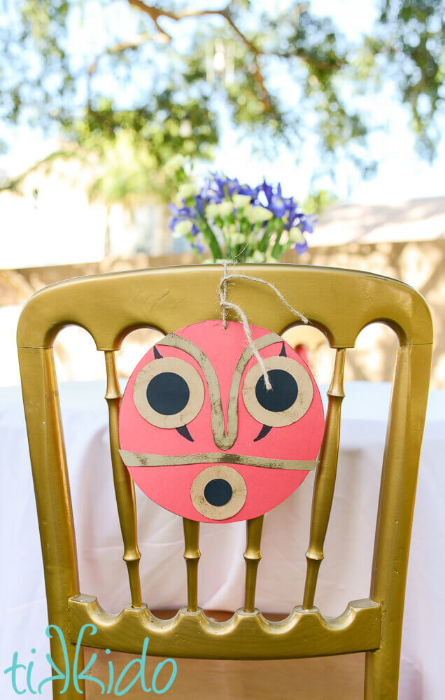 Paper princess Mononoke mask used as birthday party decor.