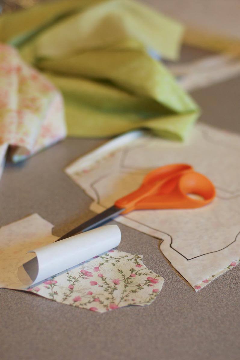 Fabric being cut into onesie shapes for the Baby Shower Garland