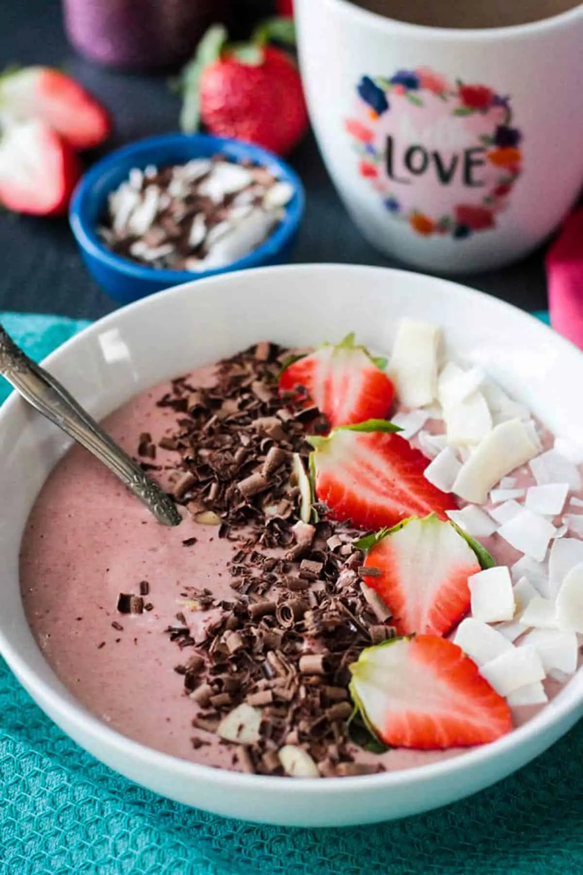 Chocolate covered strawberry smoothie bowl for a Valentine's day breakfast.