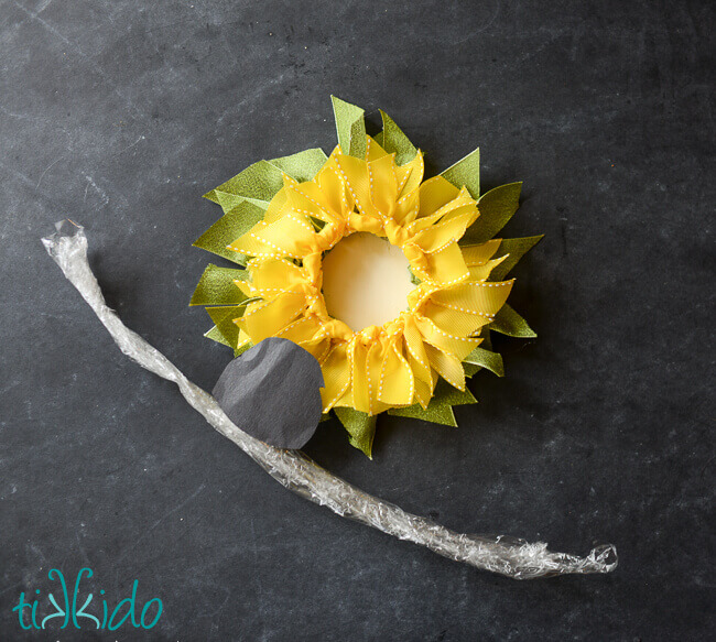 Leaves and petals of the ribbon sunflower being assembled.