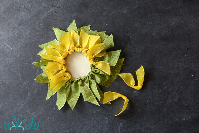 Leaves and petals of the ribbon sunflower being assembled.