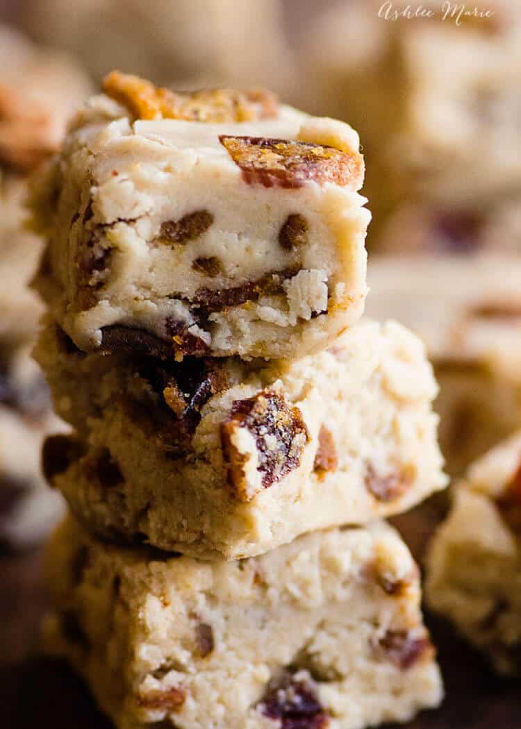 A closeup photo of a stack of three pieces of maple bacon fudge.