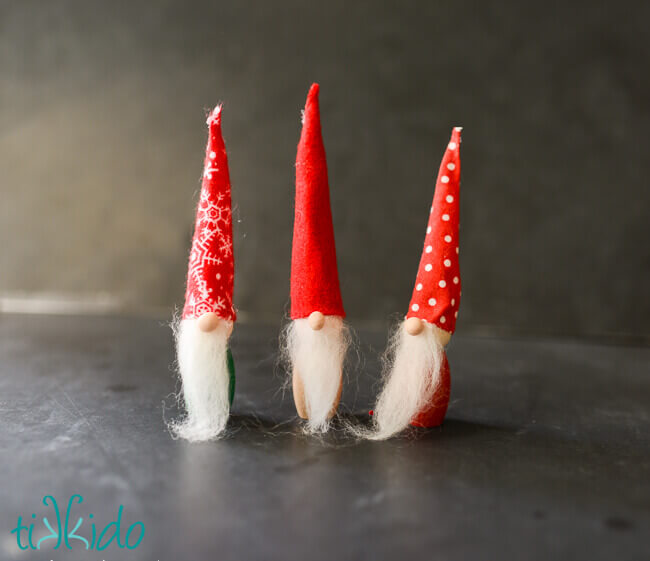 Three assembled tomte Scandinavian Christmas elf ornaments.