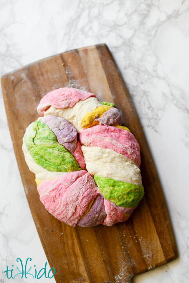 Rainbow bagel dough twisted together and ready to form into bagels.