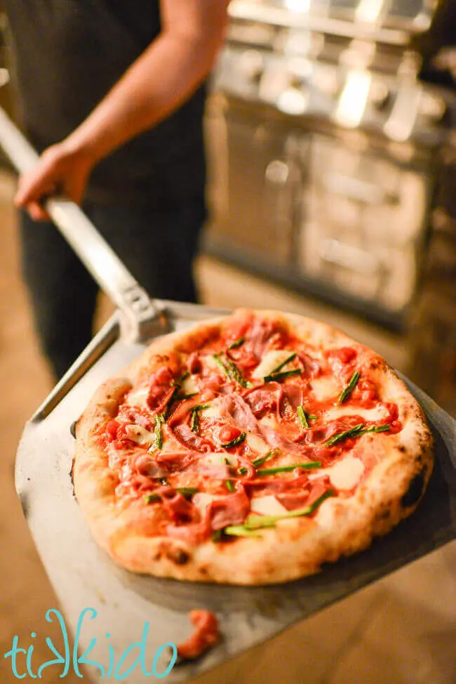 Freshly cooked Neapolitan Pizza on a pizza peel.