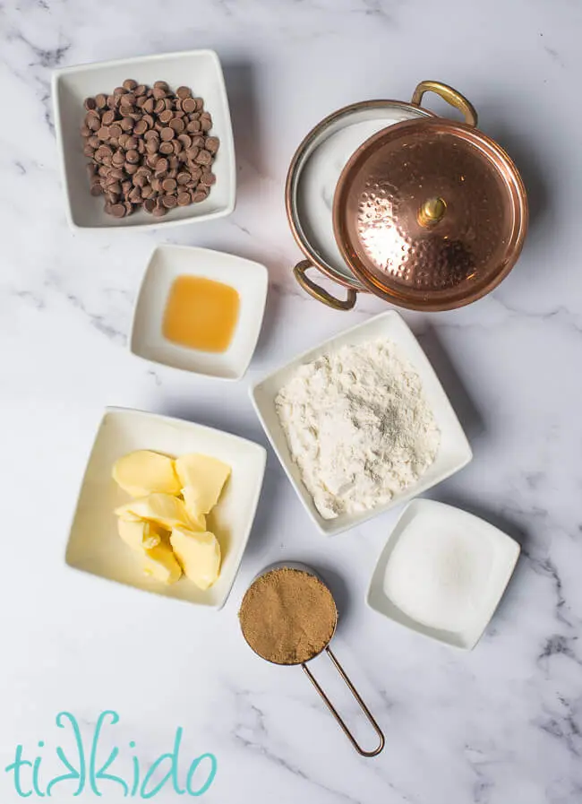 Ingredients for safe, edible cookie dough measured out on a white marble surface.