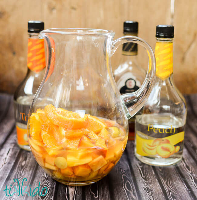 Fruit soaked in triple sec, brandy, and peach schnapps for White Sangria Recipe.